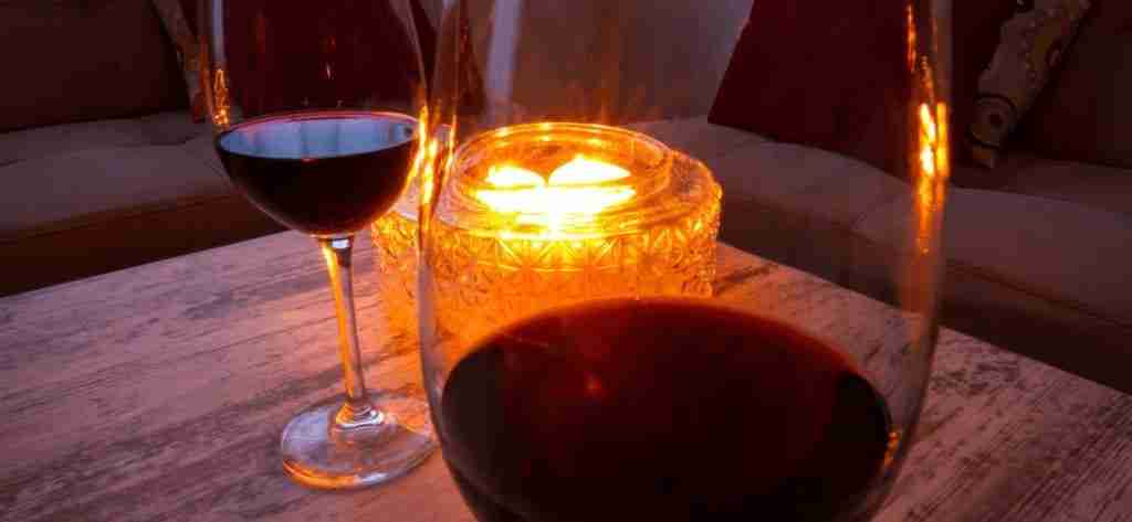 Washington Red wine on a table with a candle