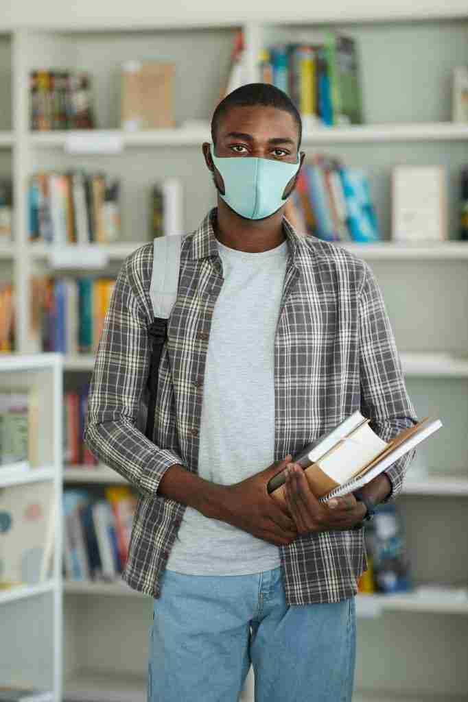 African Student Wearing Mask in Library