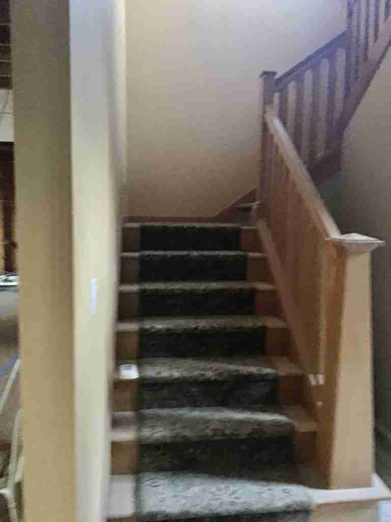 Complete Before and After Home Renovation . Photo of front staircase before the renovation
