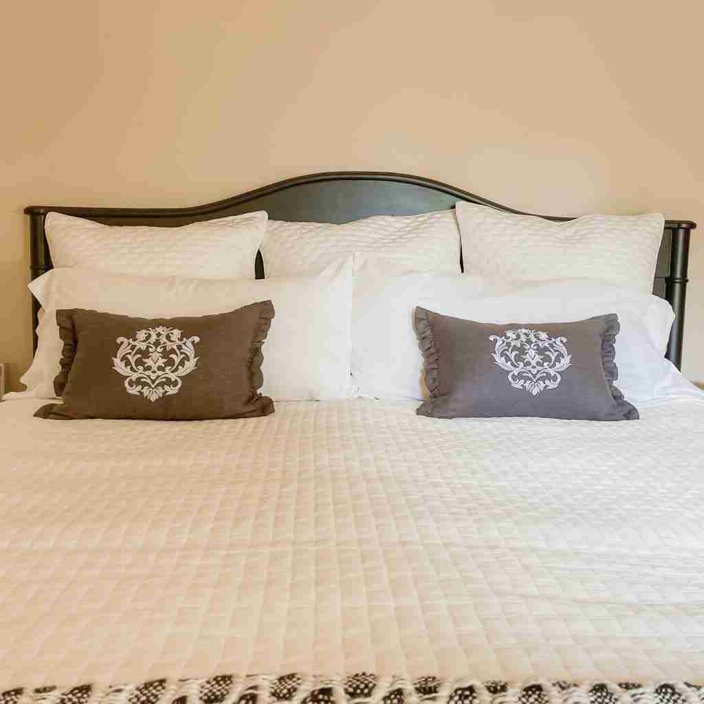 Ivory bedding coverlet