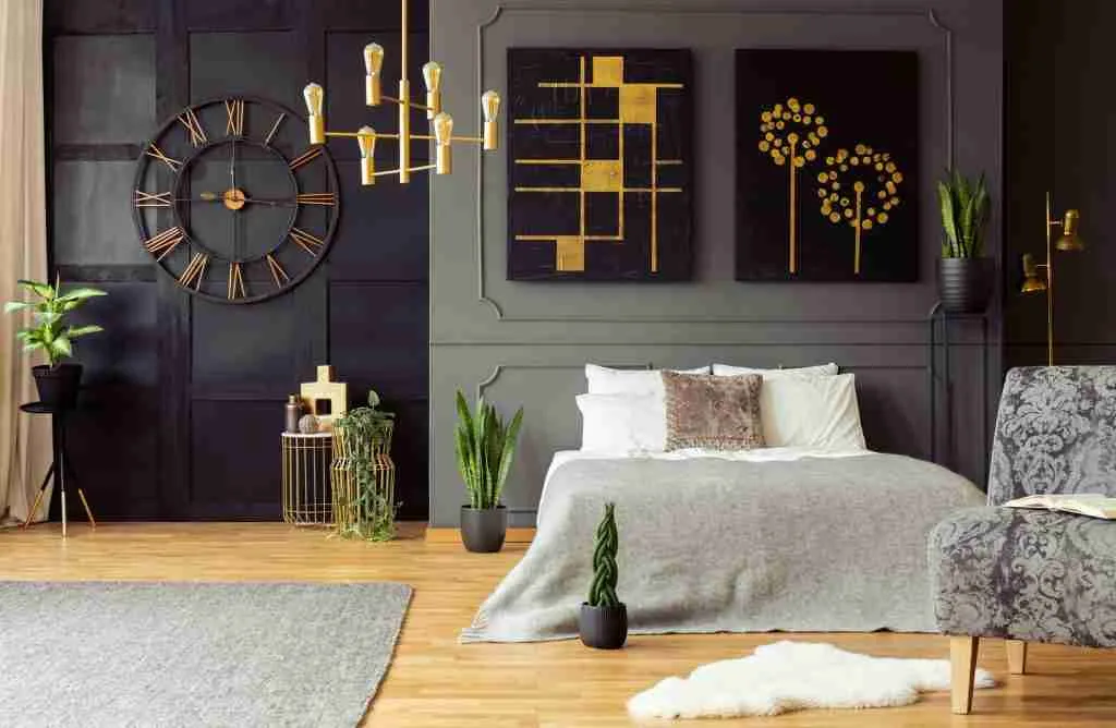 Real photo of golden accents, clock, paintings, plants and doubl