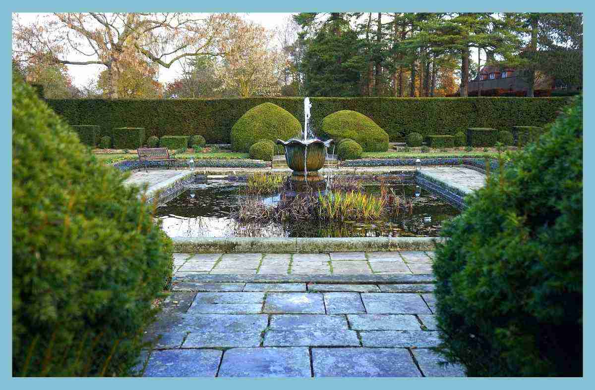 a special place to relax. Water fountain in english garden . Create an outdoor oasis