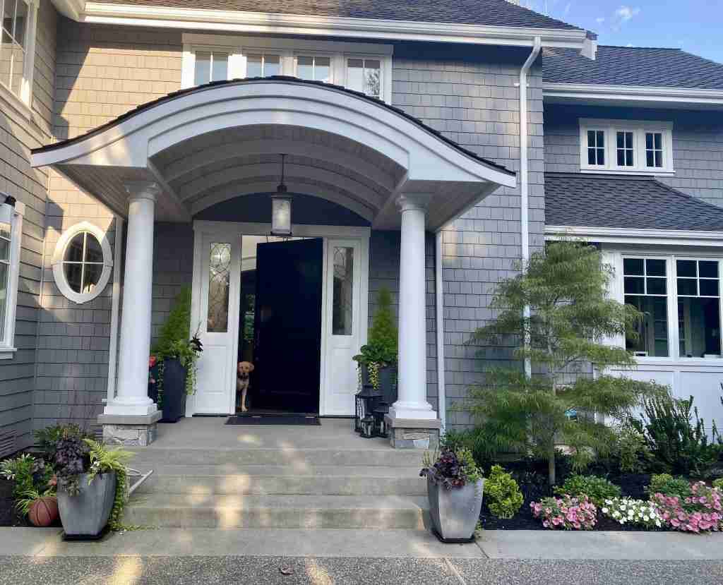 Gray Shingled Home with whit trim