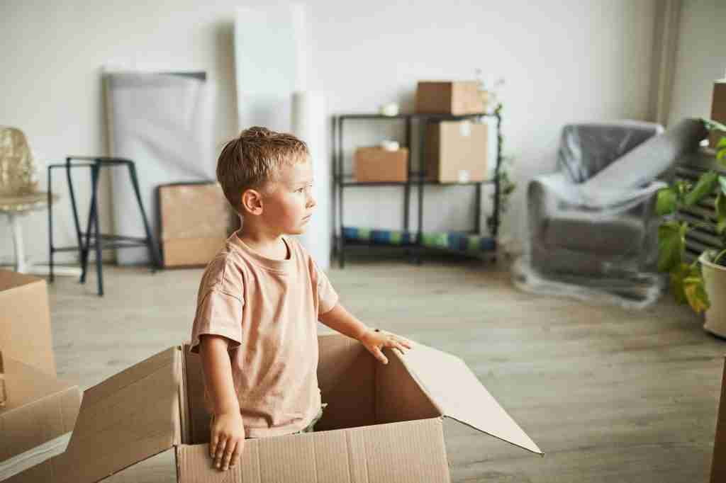 Kid Playing in Box