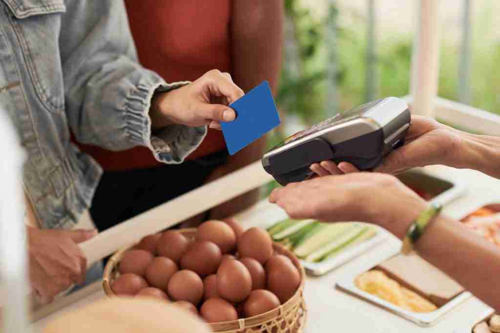 Customer Buying Food at Market