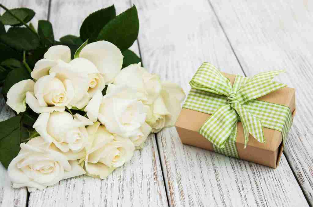 White roses and gift box