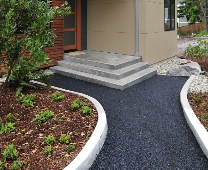 Basalt pathway in front of a modern home