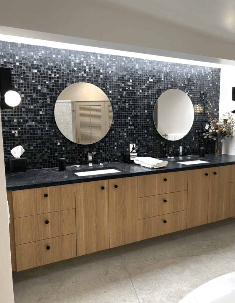 Mid century Modern Bathroom with tile and round mirrors- home remodel