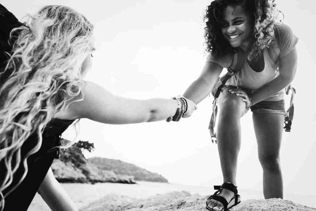 Young women helping each other