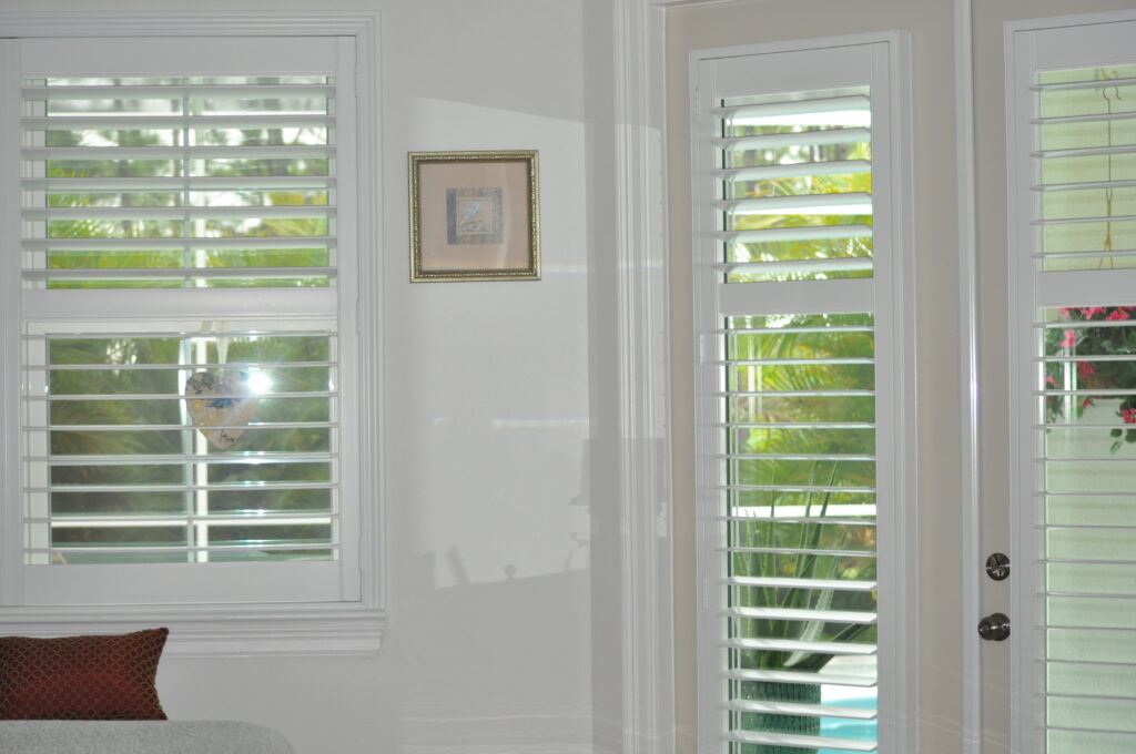 A corner of a room. plantation shutters for bathroom privacy