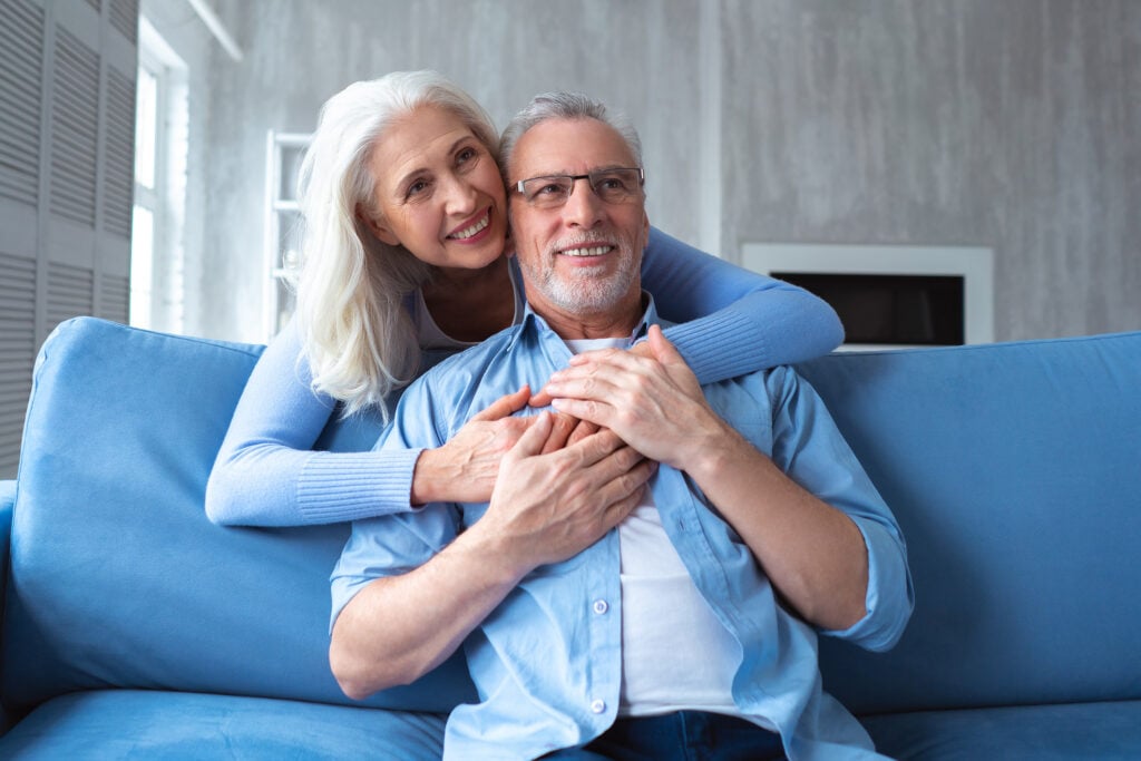 The old man and a woman hugging.