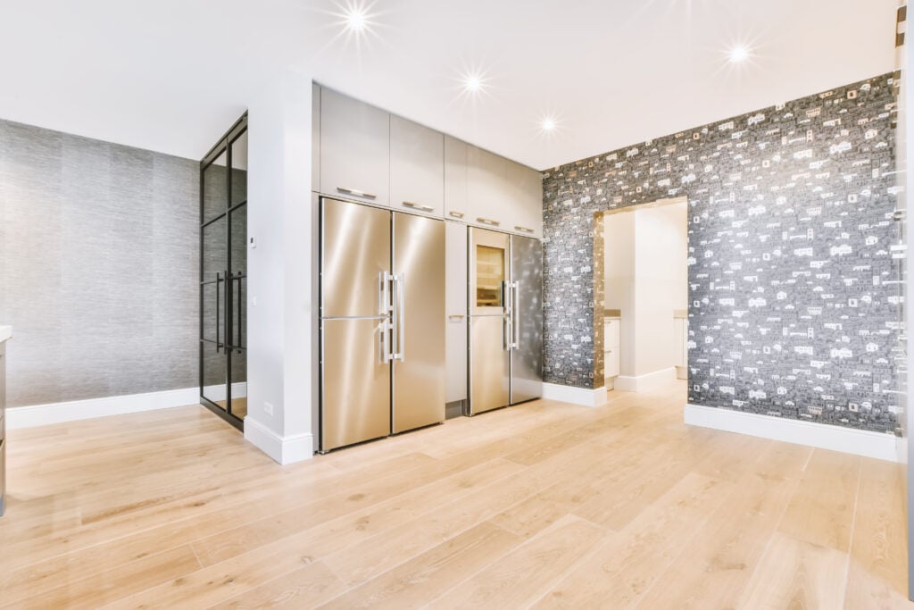 A wide apartment covered with dark wallpaper