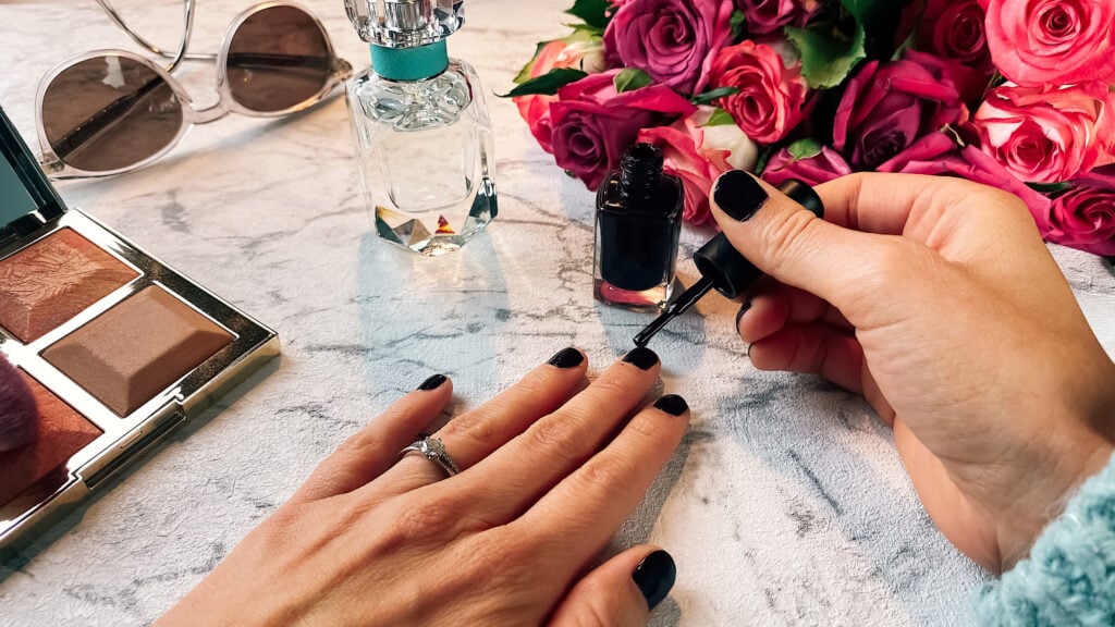 Close up of woman painting her nails