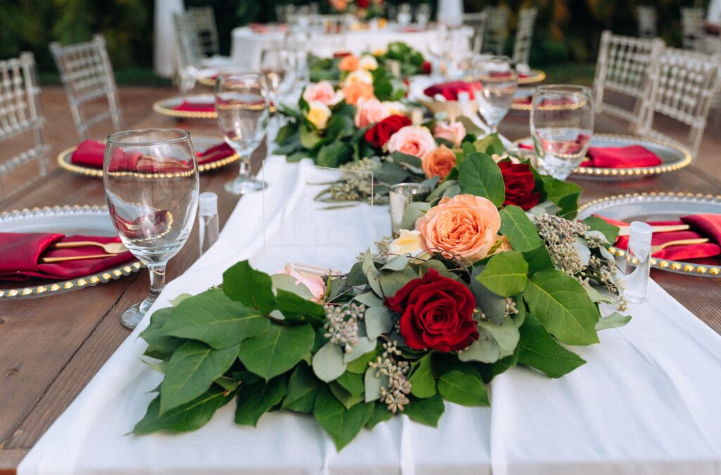 Romantic tablescape with red roses table setting for wedding event