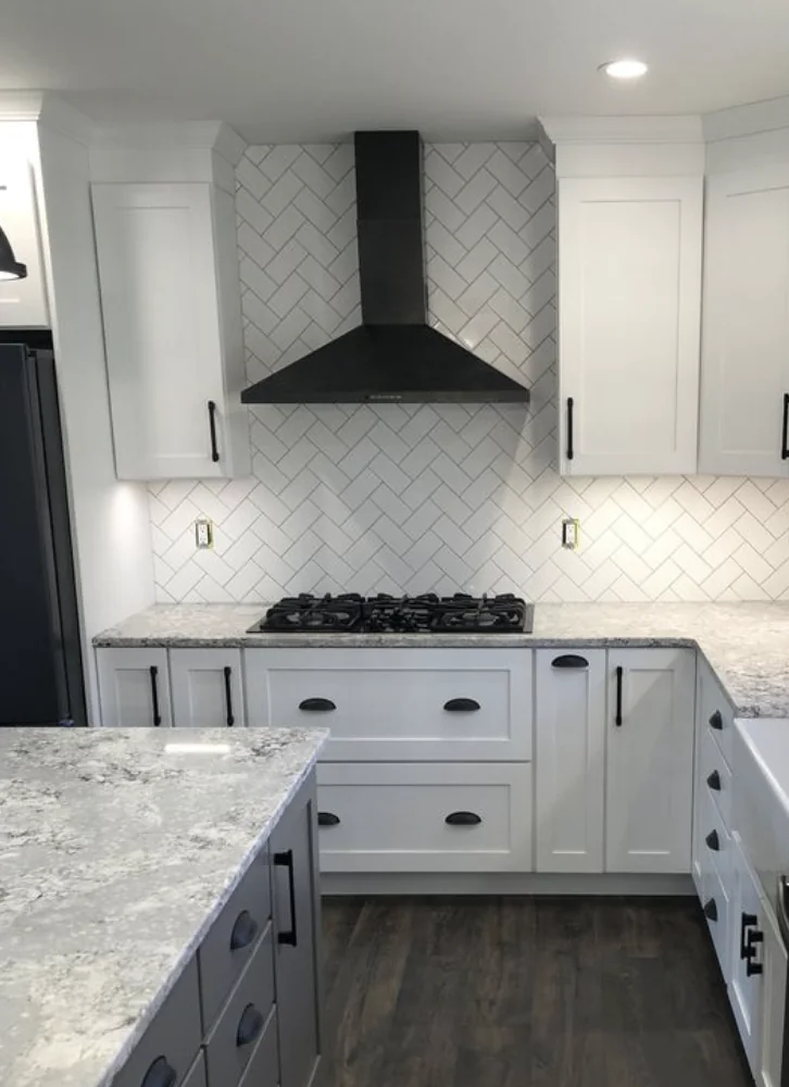white kitchen with black hardware on drawers and doors