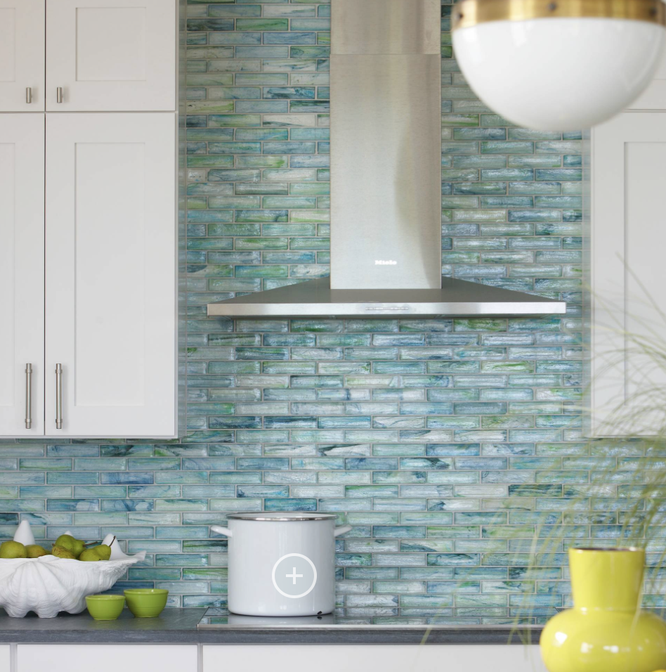 Blue glass backsplash in white kitchen