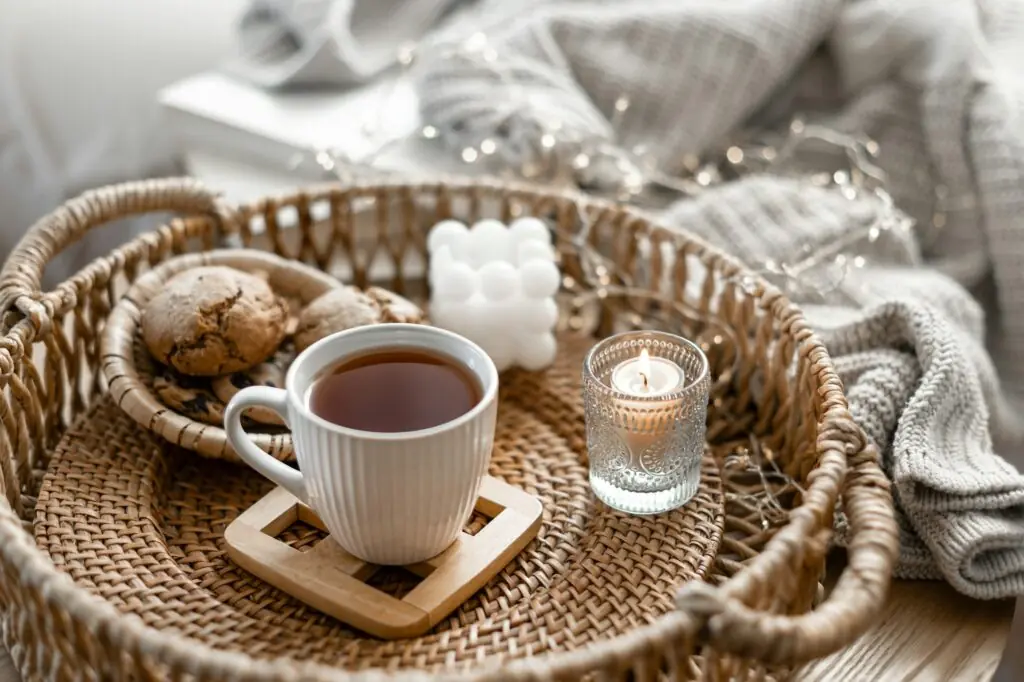 Home coziness composition with a cup of tea. Autumn home comfort.