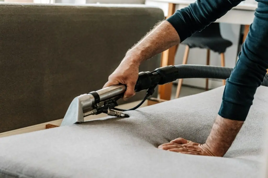 Professional cleaning service deep cleaning sofa at home.