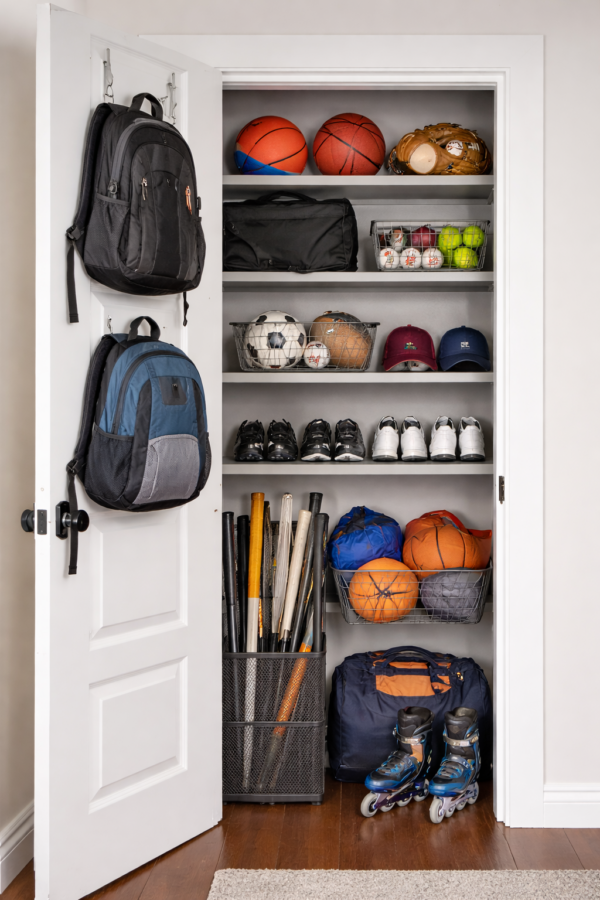 Boys sports clost with sports balls and bats etc.